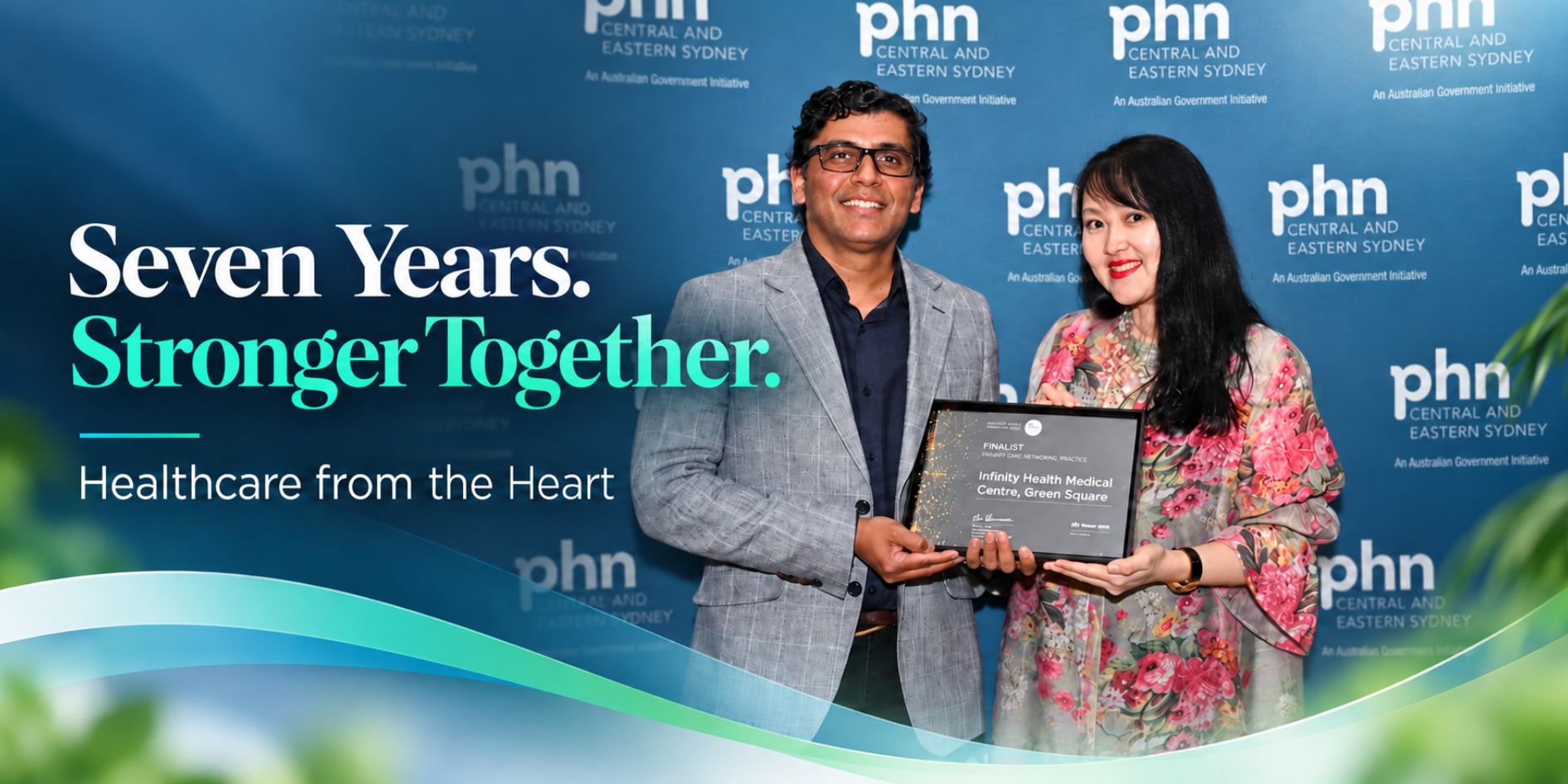 Infinity Health Green Square seventh anniversary banner featuring the Infinity building and the message Seven Years Stronger Together.